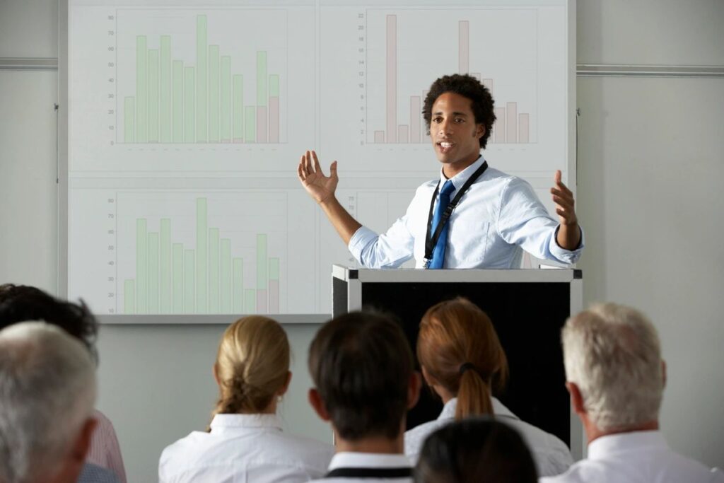 person presenting to a group of people